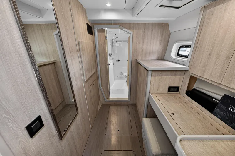  Yacht Photos Pics Interior of 2016 Leopard 44 Owners Version yacht, featuring modern wood finishes and compact design.