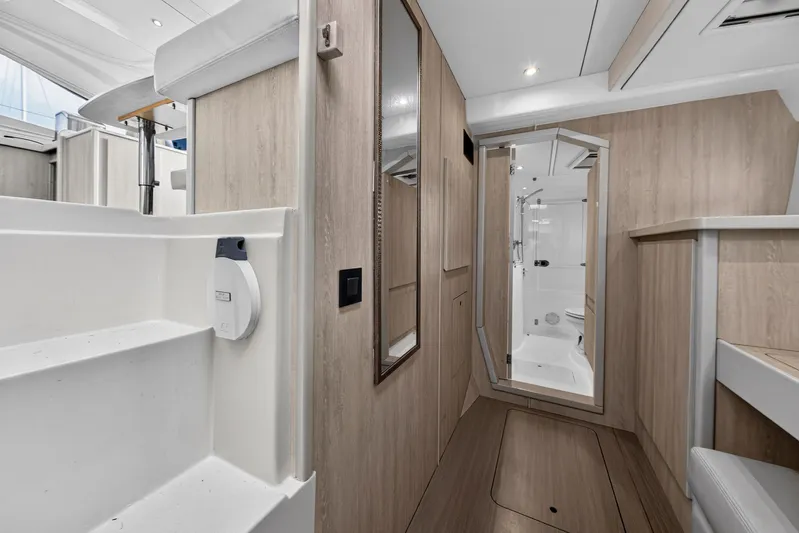  Yacht Photos Pics Interior of 2016 Leopard 44 Owners Version yacht, featuring modern wood finishes and sleek design.