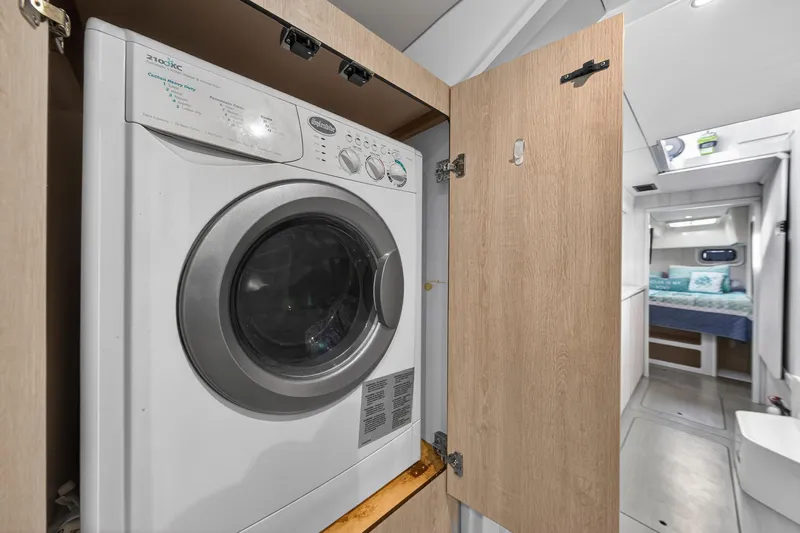  Yacht Photos Pics Washing machine in 2016 Leopard 44 Owners Version yacht interior, with bedroom view.