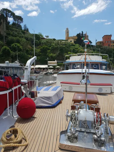  Yacht Photos Pics Deck view of 1965 Feadship CARAVELLE 23 yacht in scenic harbor.