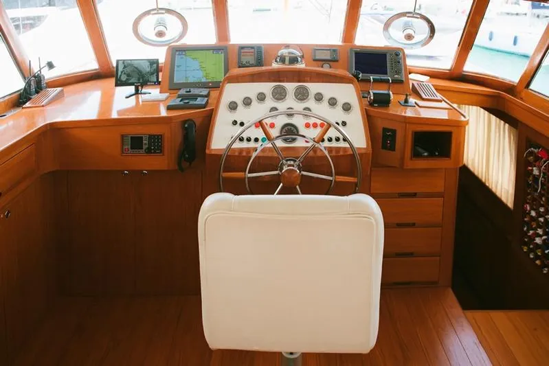  Yacht Photos Pics Helm of 1965 Feadship CARAVELLE 23 yacht with classic wooden interior and navigation equipment.