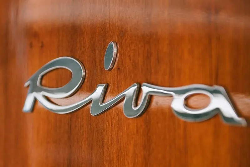  Yacht Photos Pics Chrome "Riva" logo on polished wooden surface, Feadship CARAVELLE 23, 1965 model.