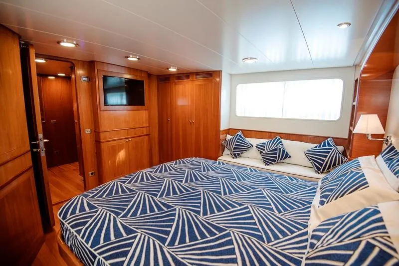  Yacht Photos Pics Luxurious cabin interior of 1965 Feadship CARAVELLE 23 yacht with geometric bedding.