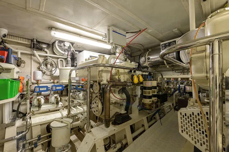  Yacht Photos Pics Engine room of 1965 Feadship CARAVELLE 23 yacht, showcasing complex machinery and equipment.