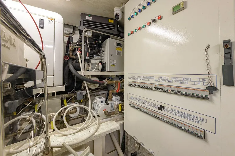  Yacht Photos Pics Engine room of 1965 Feadship CARAVELLE 23 yacht with control panels and machinery.