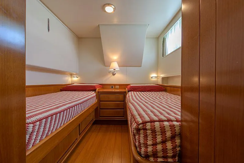  Yacht Photos Pics Twin cabin with striped bedding on 1965 Feadship CARAVELLE 23 yacht.