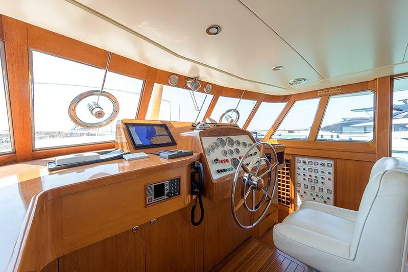  Yacht Photos Pics Helm of 1965 Feadship CARAVELLE 23 yacht with wooden interior and navigation equipment.