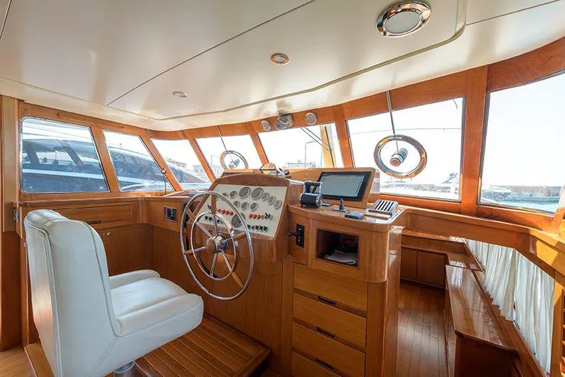  Yacht Photos Pics Helm of 1965 Feadship CARAVELLE 23 yacht with wooden interior and steering wheel.