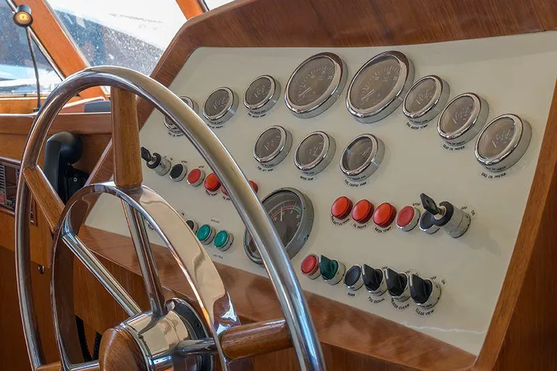  Yacht Photos Pics Steering wheel and control panel of 1965 Feadship CARAVELLE 23 yacht.