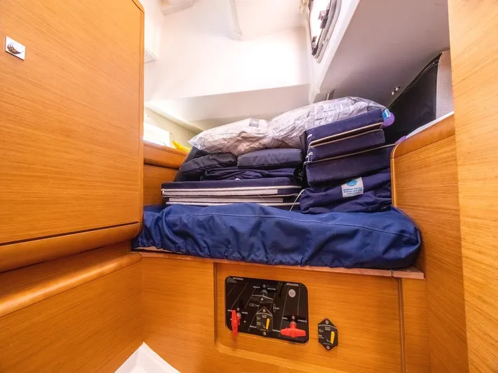  Yacht Photos Pics Interior cabin of 2013 Jeanneau Sun Odyssey 439 with storage and bedding.