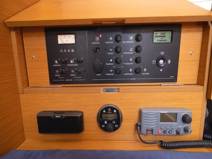  Yacht Photos Pics Control panel of 2013 Jeanneau Sun Odyssey 439 performance sailboat, featuring navigation and communication equipment.
