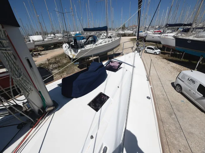  Yacht Photos Pics Jeanneau Sun Odyssey 439 performance sailboat, 2013 model, docked in a marina with other boats.