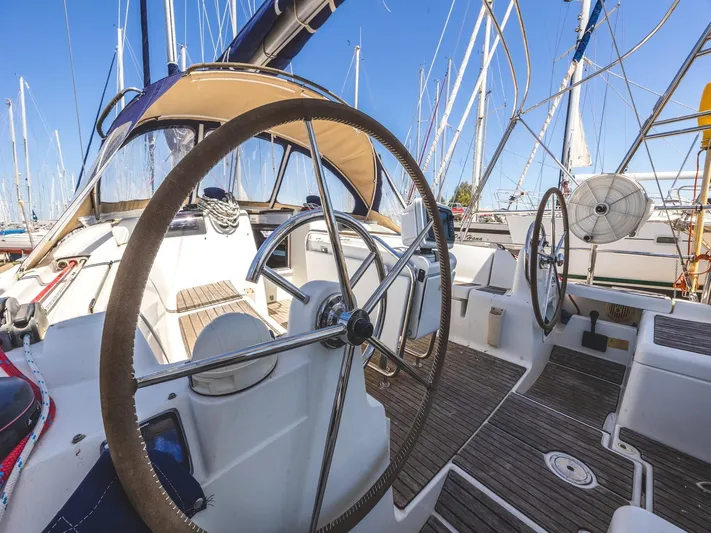  Yacht Photos Pics 2013 Jeanneau Sun Odyssey 439 performance yacht cockpit with dual steering wheels and teak decking.