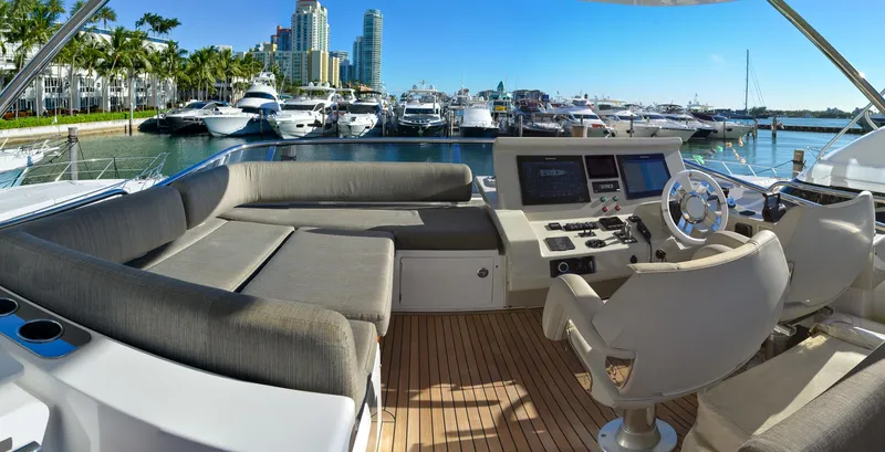 Cerulean Yacht Photos Pics 2018 Azimut 66 yacht interior with luxurious seating and modern control panel.