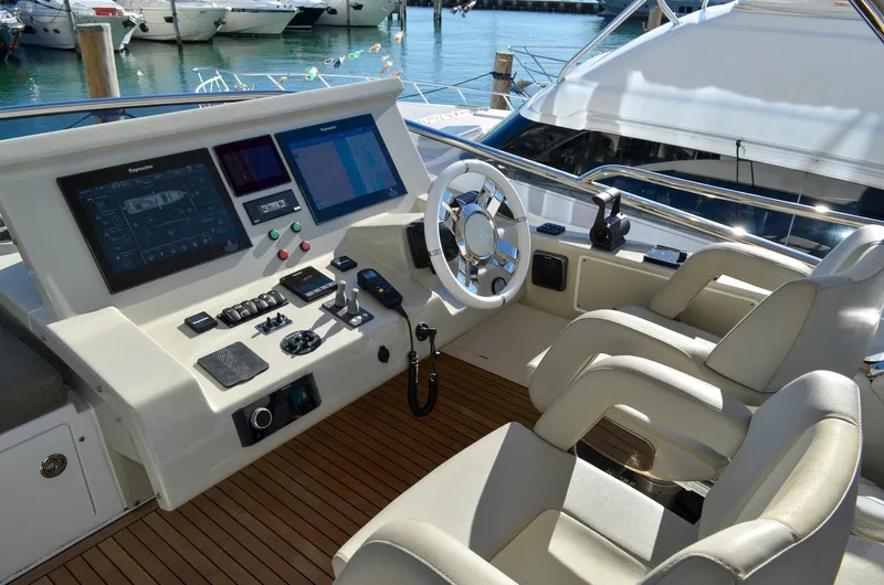Cerulean Yacht Photos Pics 2018 Azimut 66 yacht helm station with modern navigation equipment and luxurious seating.