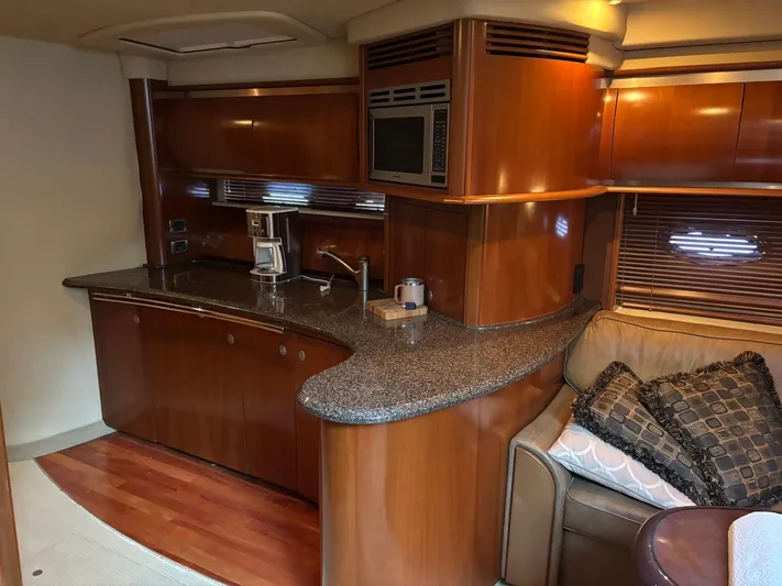 Tradition Yacht Photos Pics Luxurious 2005 Sea Ray 500 Sundancer yacht interior with modern kitchen and cozy seating area.