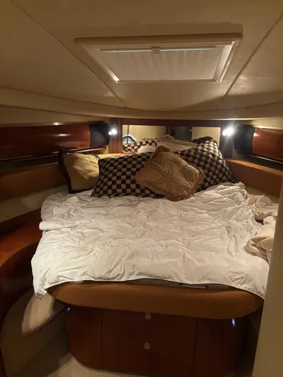 Tradition Yacht Photos Pics Luxurious cabin interior of 2005 Sea Ray 500 Sundancer yacht with cozy bedding.