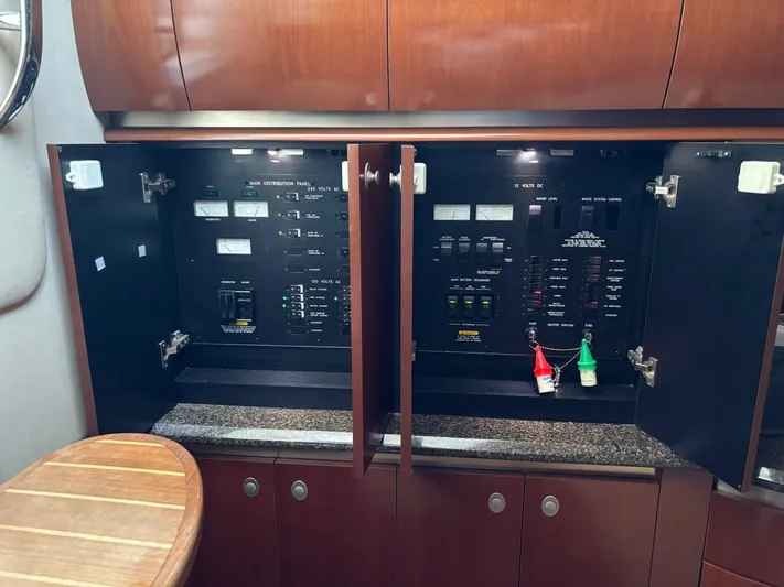 Tradition Yacht Photos Pics Electrical panel inside 2005 Sea Ray 500 Sundancer yacht, featuring control switches and indicators.