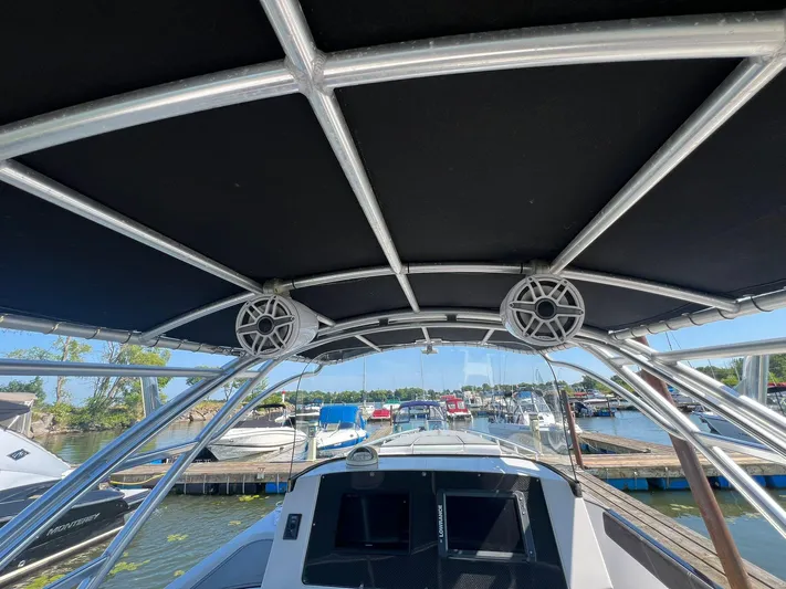  Yacht Photos Pics 2006 Donzi 38 ZFX boat interior with speakers and marina view.