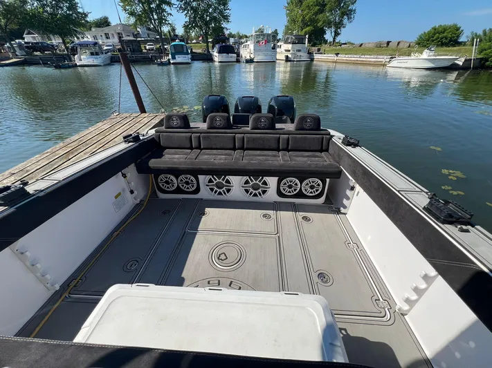  Yacht Photos Pics 2006 Donzi 38 ZFX boat interior with seating and speakers at a marina.
