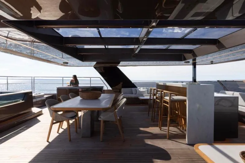 Twilight Yacht Photos Pics Luxurious Sunreef 100 Power yacht deck with modern seating and ocean view, 2025 model.
