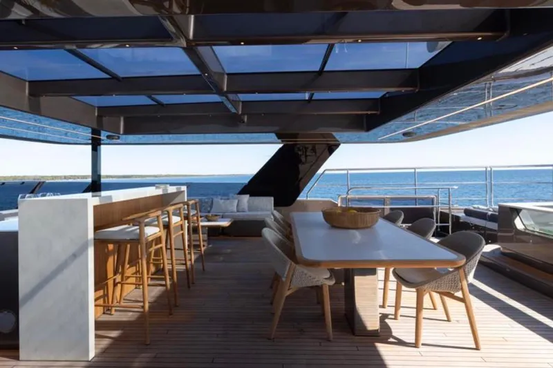 Twilight Yacht Photos Pics Luxurious Sunreef 100 Power yacht deck with elegant seating and ocean view, 2025 model.