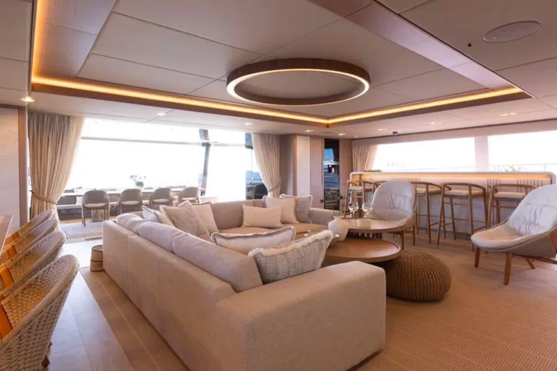 Twilight Yacht Photos Pics Luxurious interior of 2025 Sunreef 100 Power yacht with modern seating and elegant decor.