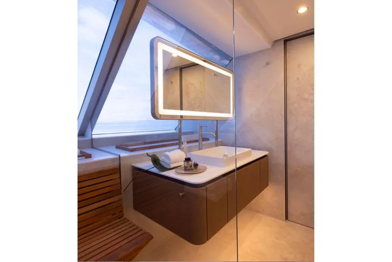 Twilight Yacht Photos Pics Luxurious bathroom interior on 2025 Sunreef 100 Power yacht with modern fixtures and large window.