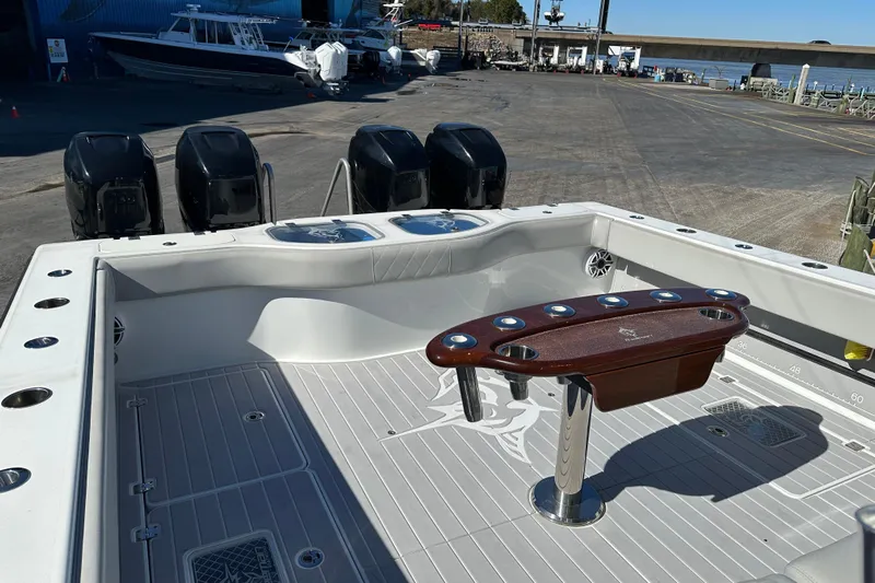  Yacht Photos Pics Freeman 42LR 2023 boat deck with multiple outboard motors and fishing rod holders.