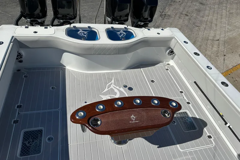  Yacht Photos Pics 2023 Freeman 42LR boat deck with fishing rod holders and sleek design.