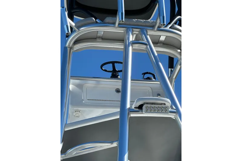  Yacht Photos Pics 2023 Freeman 42LR boat tower with steering wheel against clear blue sky.