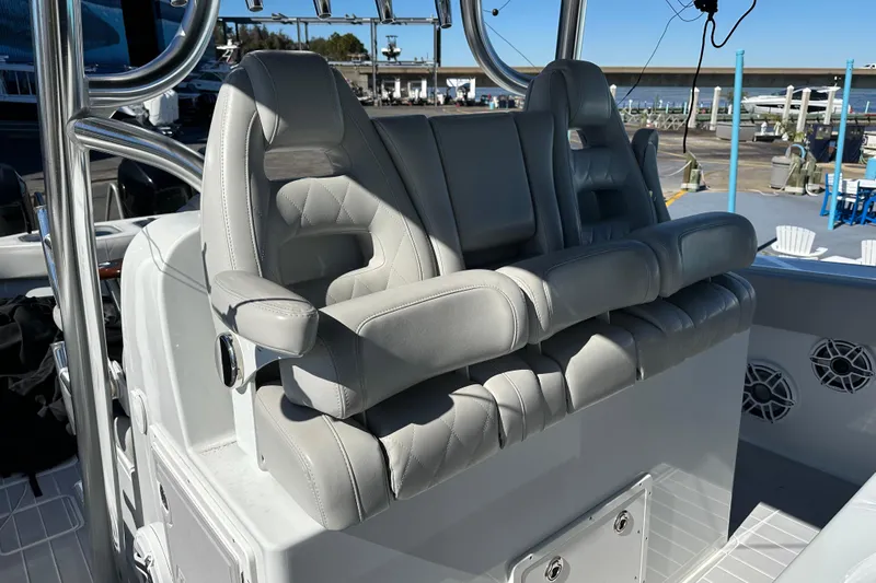  Yacht Photos Pics Luxurious seating on a 2023 Freeman 42LR boat, featuring plush gray upholstery.