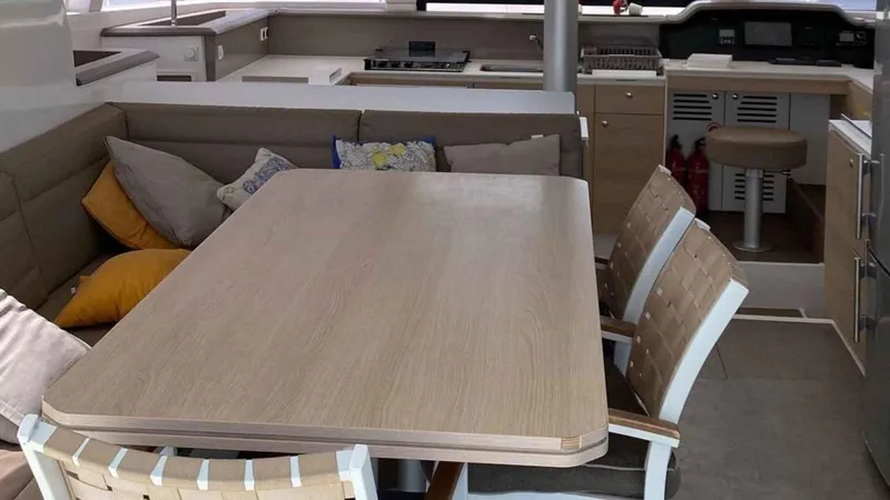  Yacht Photos Pics Interior of a 2019 Bali 4.1 yacht with dining table and chairs.