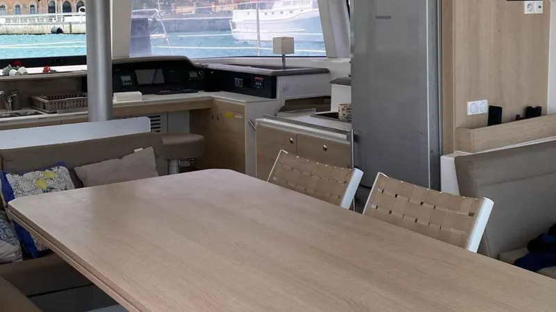  Yacht Photos Pics Interior of a 2019 Bali 4.1 yacht with dining table and chairs.