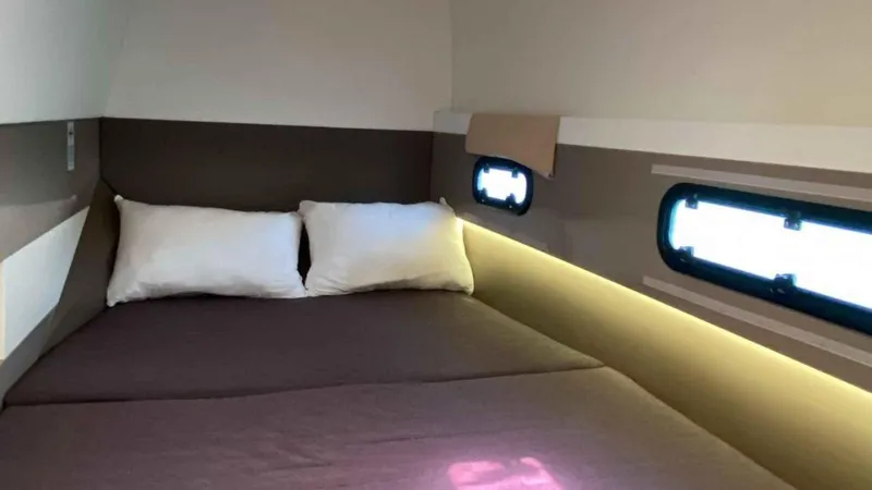  Yacht Photos Pics Interior of Bali 4.1 yacht, cozy bedroom with windows.