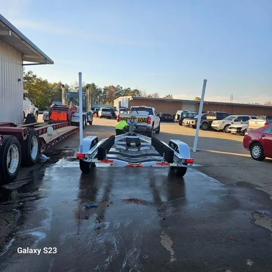  Yacht Photos Pics Boat trailer parked in a lot, Ocean Scout 277 model, 2020.