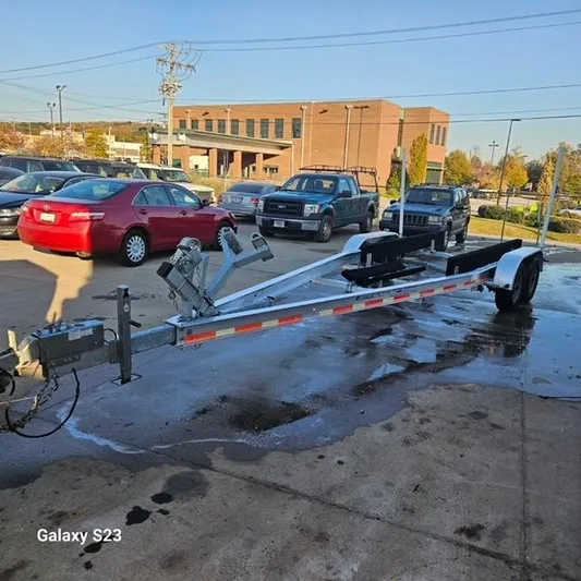  Yacht Photos Pics Boat trailer parked in a lot, Ocean Scout 277 model, 2020.