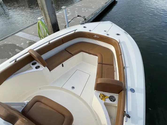  Yacht Photos Pics 2020 Ocean Scout 277 boat with brown seating, docked at marina.
