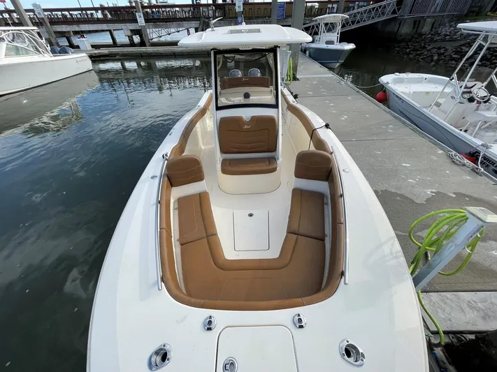  Yacht Photos Pics 2020 Ocean Scout 277 boat docked, featuring spacious seating and sleek design.