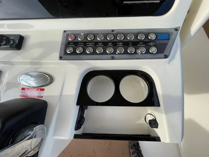  Yacht Photos Pics Control panel and cup holders on a 2020 Ocean Scout 277 boat.