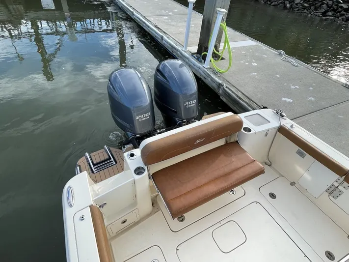  Yacht Photos Pics 2020 Ocean Scout 277 boat with twin outboard engines docked at marina.