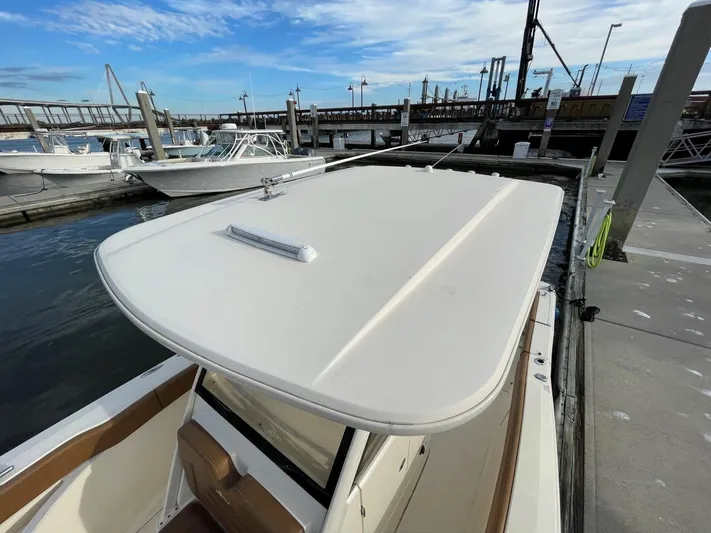  Yacht Photos Pics 2020 Ocean Scout 277 boat docked at marina under blue sky.