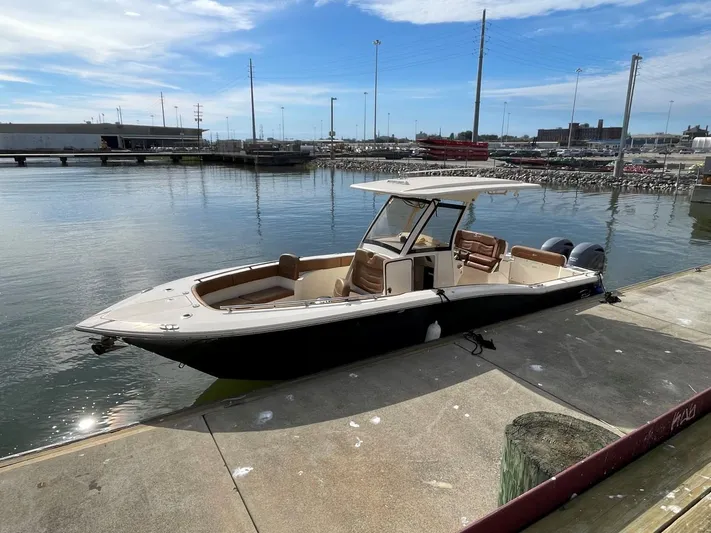  Yacht Photos Pics 2020 Ocean Scout 277 boat docked at marina under clear sky.