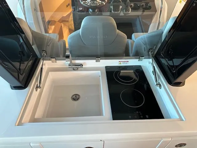 Pardo 38 Yacht Photos Pics Modern kitchen area on 2023 Pardo Yachts 38 with sink and stovetop.
