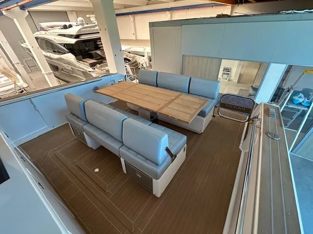 Pardo 38 Yacht Photos Pics 2023 Pardo Yachts 38 interior with elegant seating and wooden table.