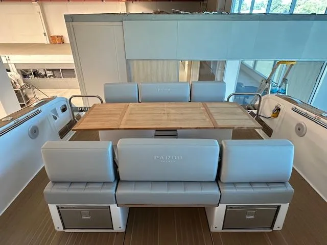 Pardo 38 Yacht Photos Pics 2023 Pardo Yachts 38 interior with elegant seating and wooden table.