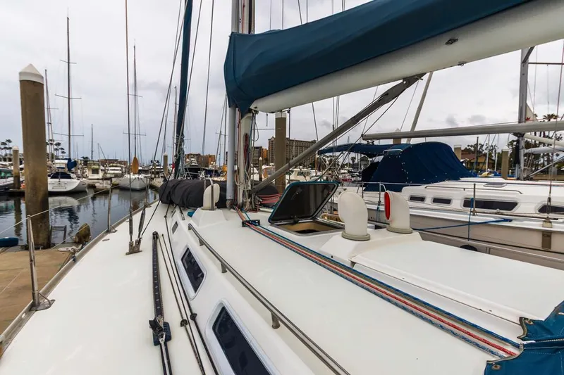 Lark Yacht Photos Pics 2001 J Boats 46 sailboat docked in a marina, showcasing deck and rigging.