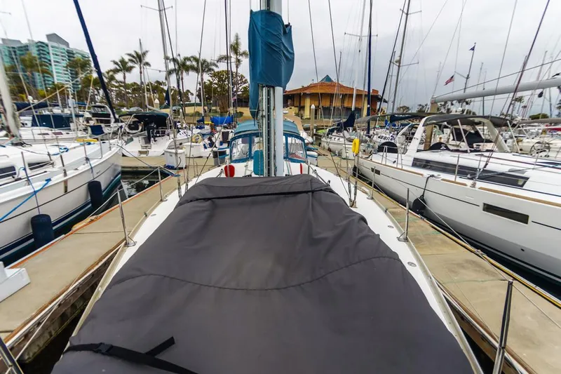 Lark Yacht Photos Pics Sailboat docked in marina, J Boats 46 model, 2001, surrounded by other vessels.
