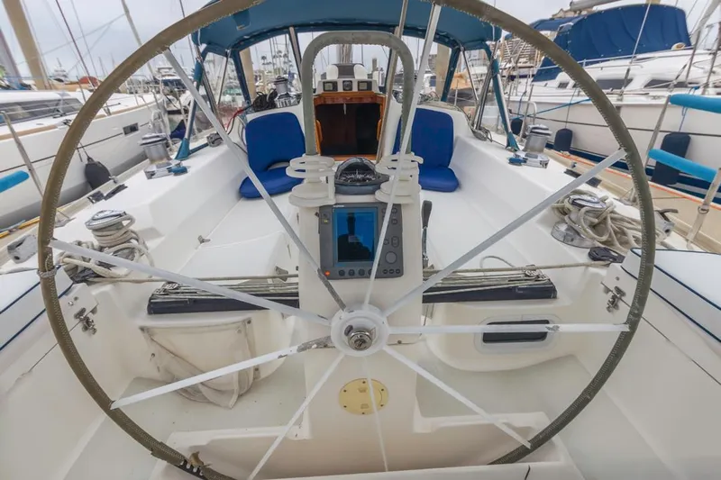 Lark Yacht Photos Pics 2001 J Boats 46 sailboat cockpit with steering wheel and navigation equipment.
