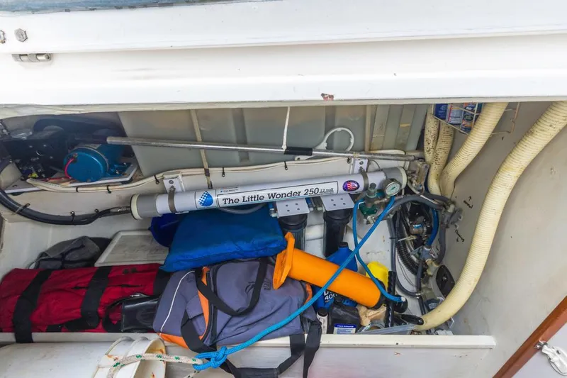 Lark Yacht Photos Pics Storage compartment of a 2001 J Boats 46, featuring equipment and supplies.